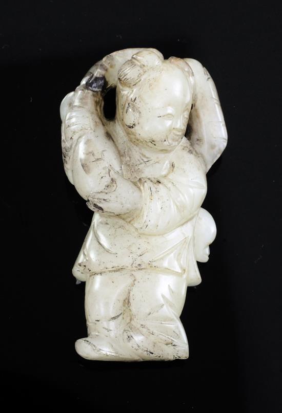 A Chinese white and black jade figure of a boy, 18th / 19th century, 5.8cm